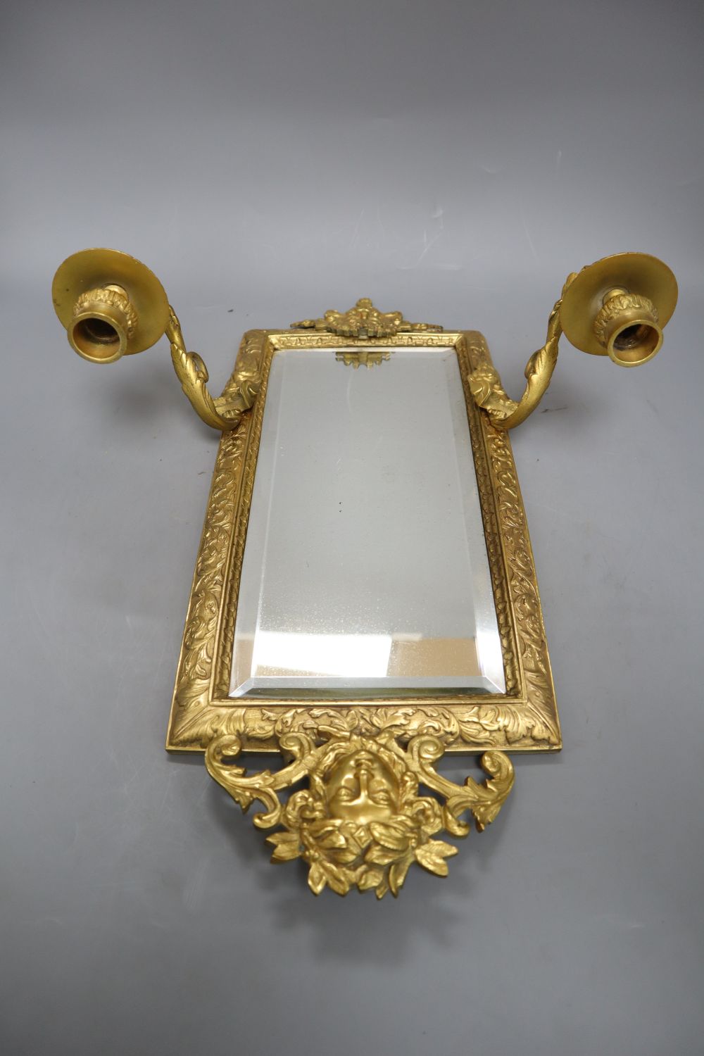 A Victorian cast brass two branch girandole, length 39cm